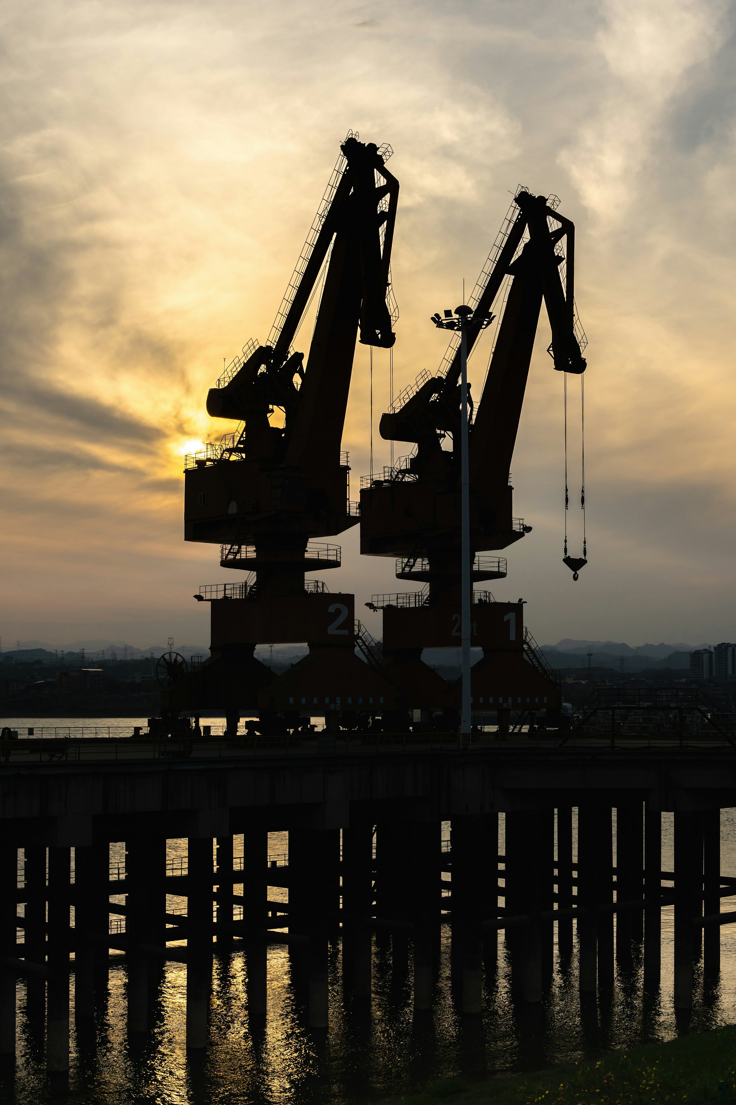 Port cranes at dusk