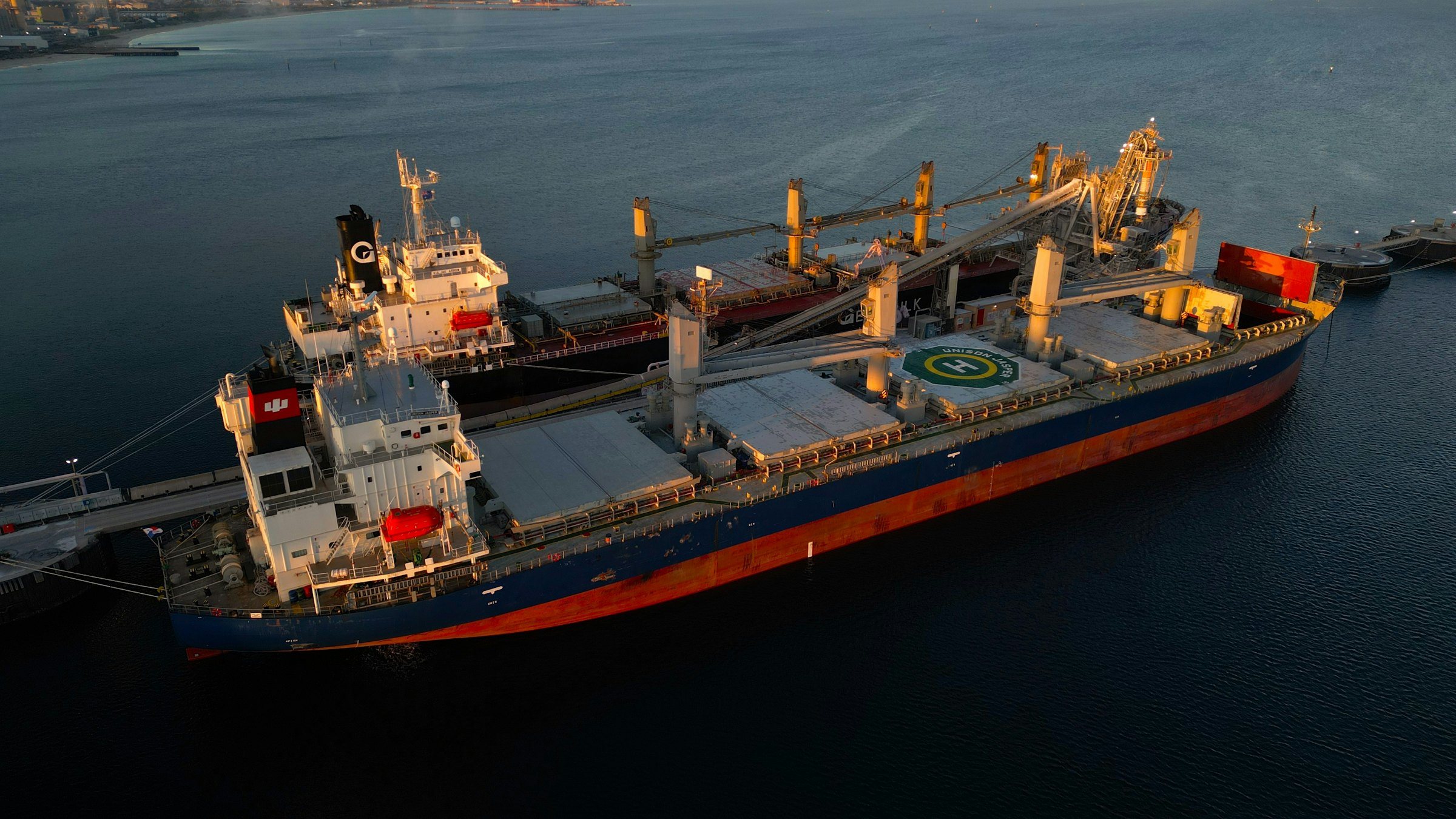Aerial view of bulk carriers loading at a port