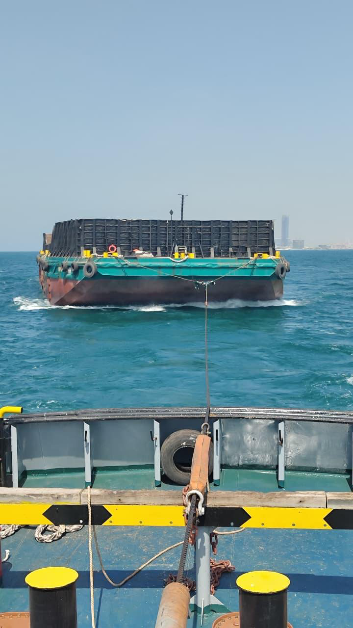Towing a loaded barge offshore